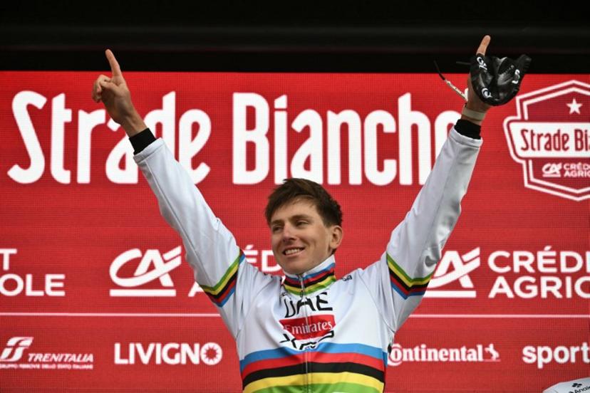 Team UAE's Slovenain rider Tadej Pogacar celebrates on the podium after winning the 19th one-day classic 'Strade Bianche' (White Roads) men's cycling race between Siena and Siena in Tuscany on March 8, 2025.  Marco BERTORELLO / AFP