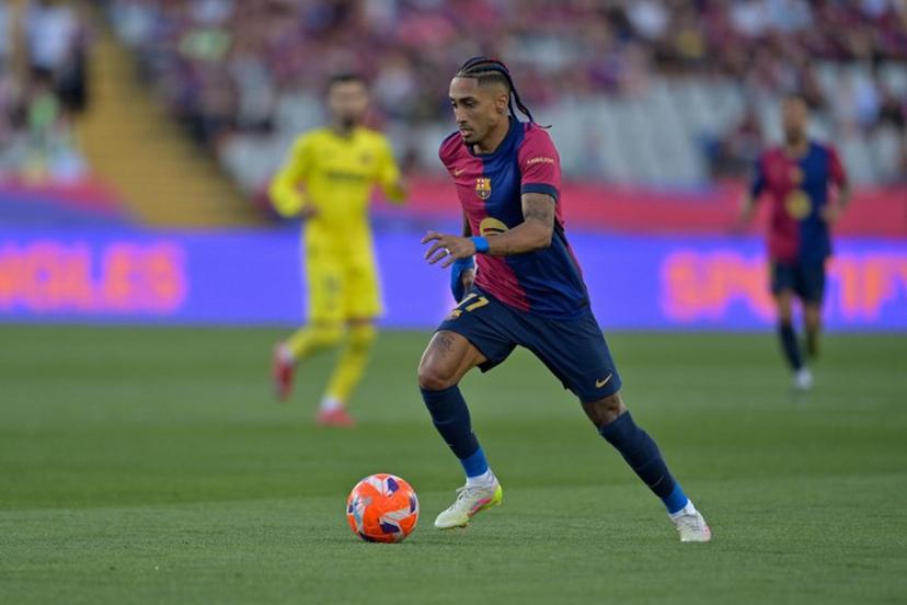 Barcelona's Brazilian forward #11 Raphinha controls the ball during the Spanish league football match between FC Barcelona and Villarreal CF at Estadi Olimpic Lluis Companys in Barcelona on May 18, 2025.  MANAURE QUINTERO / AFP