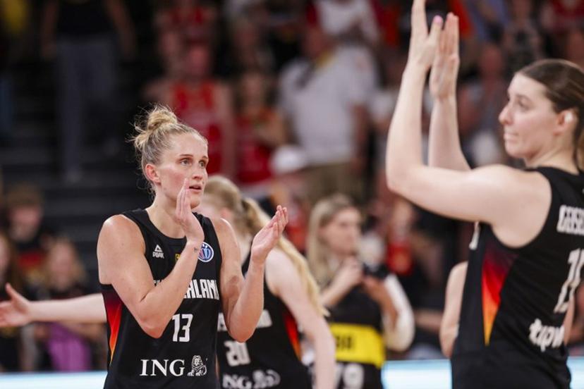 Leonie Fiebich from Germany (L) and Luisa Geiselsoeder from Germany react on June 20, 2025 after the group stage match between and Spain and Germany at the European Women's Basketball Championship in Hamburg.   FRANK MOLTER / AFP