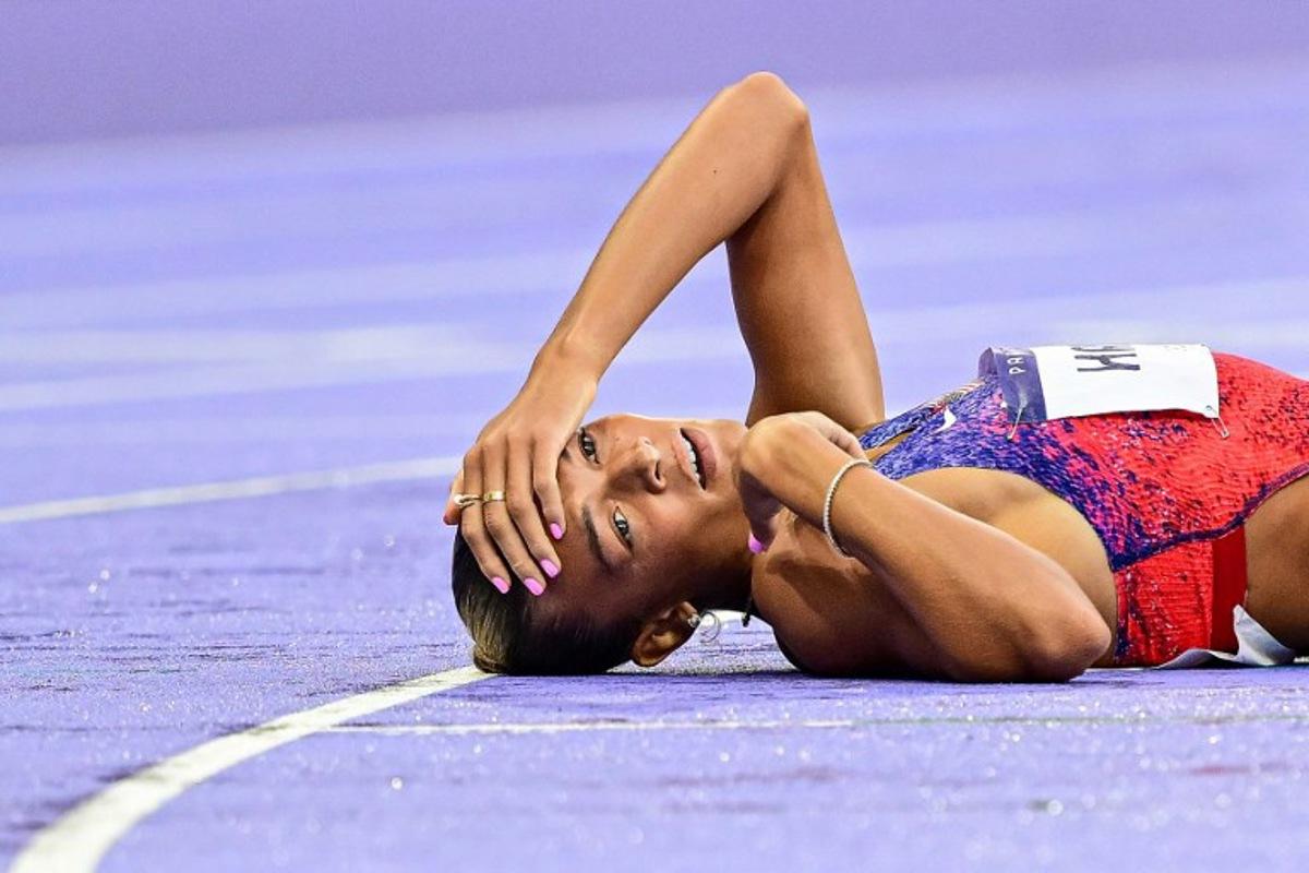 US' Anna Hall reacts after competing in the women's heptathlon 800m of the athletics event at the Paris 2024 Olympic Games at Stade de France in Saint-Denis, north of Paris, on August 9, 2024.  Martin  BERNETTI / AFP