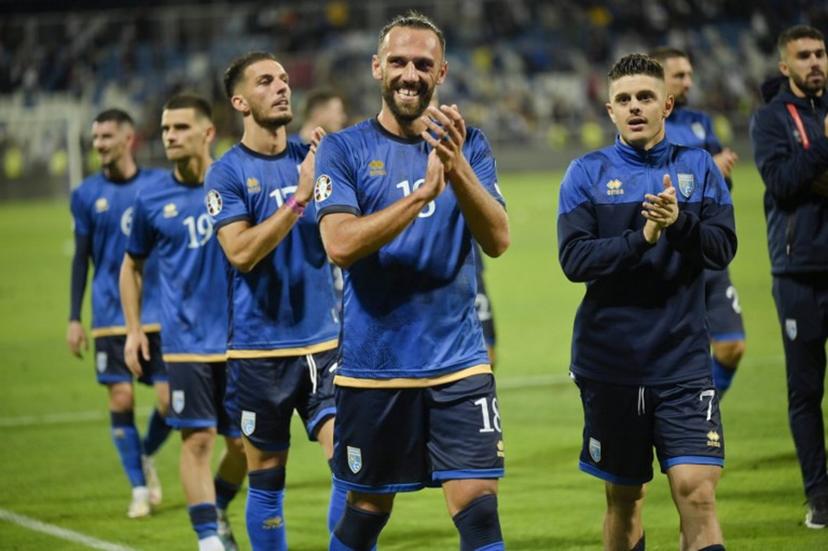 Kosovo's striker #18 Vedat Muriqi celebrates with teammates after scoring his team's second goal during the UEFA Euro 2024 Group I qualification football match between Kosovo and Switzerland, at the "Fadil vokrri" Stadium in Pristina on September 9, 2023.  Armend NIMANI / AFP
