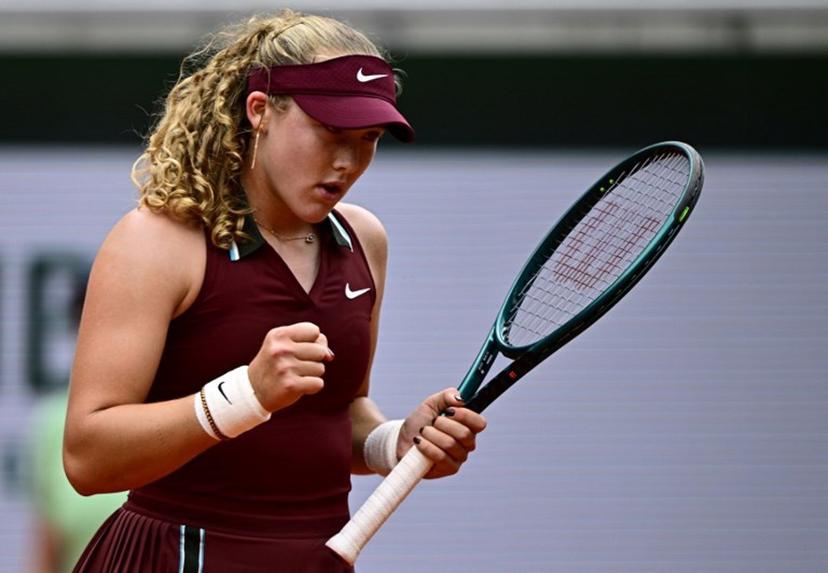 Russia's Mirra Andreeva reacts after a point during her women's singles match against Kazakhstan's Yulia Putintseva on day 7 of the French Open tennis tournament on Court Suzanne-Lenglen at the Roland-Garros Complex in Paris on May 31, 2025.  JULIEN DE ROSA / AFP