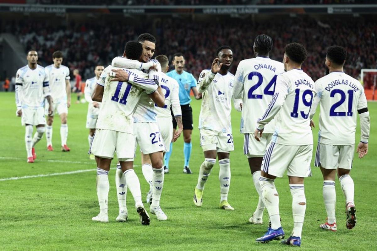 Aston Villa's English striker #11 Ollie Watkins (front L) celebrates with teammates after scoring his team's first goal during the UEFA Europa League round of 16 first leg football match between Lille (LOSC) and Aston Villa  at the Pierre-Mauroy Stadium in Villeneuve-d'Ascq, northern France, on March 12, 2026.   Sameer AL-DOUMY / AFP