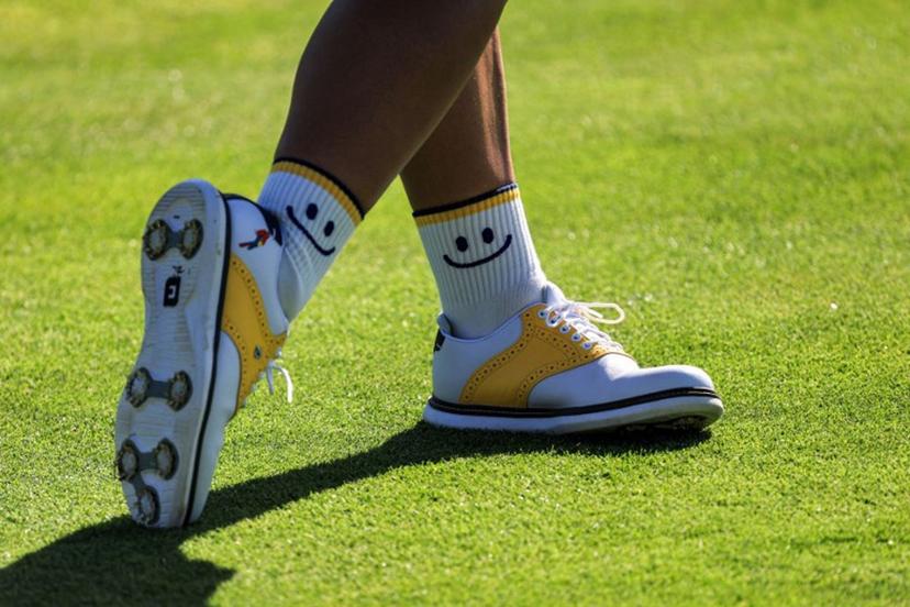 The "smiley" socks of Colombia's Maria Jose Uribe are pictured as she competes in round 2 of the women's golf individual stroke play of the Paris 2024 Olympic Games at Le Golf National in Guyancourt, south-west of Paris on August 8, 2024.   Emmanuel DUNAND / AFP