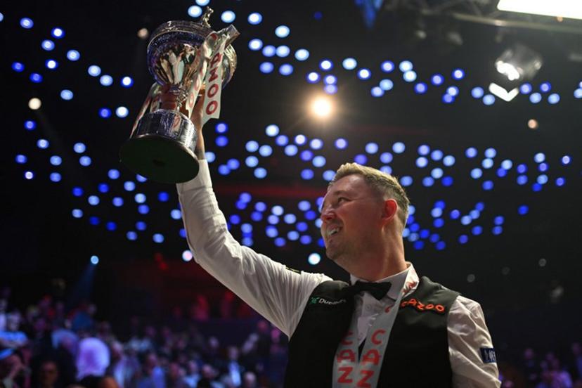 England's Kyren Wilson celebrates with the trophy after victory over Wales' Jak Jones on day two of their World Championship Snooker final at The Crucible in Sheffield, northern England on May 6, 2024.  Wilson won the final 18-14. Oli SCARFF / AFP