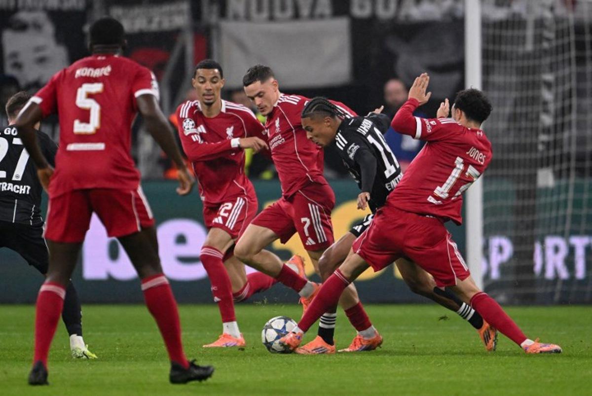 (R-l) Liverpool's English midfielder #17 Curtis Jones, Frankfurt's French forward #19 Jean-Matteo Bahoya, Liverpool's German midfielder #07 Florian Wirtz and Liverpool's French striker #22 Hugo Ekitike vie for the ball during the UEFA Champions League football match between Eintracht Frankfurt and Liverpool FC in Frankfurt, western Germany on October 22, 2025.  Kirill KUDRYAVTSEV / AFP