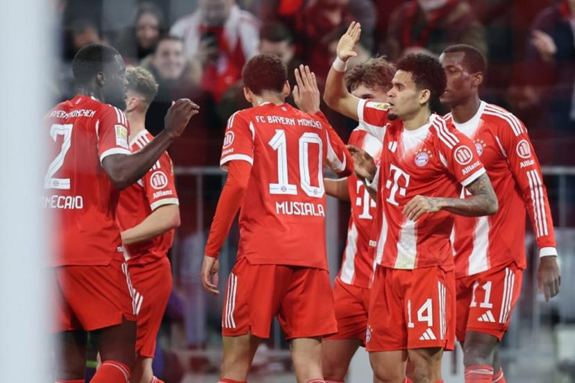 Bayern Munich's Colombian forward #14 Luis Diaz celebrates scoring his team's first goal with his team mates during the German first division Bundesliga football match between FC Bayern Munich and Borussia Moenchengladbach in Munich, southern Germany, on March 6, 2026.  Alexandra BEIER / AFP