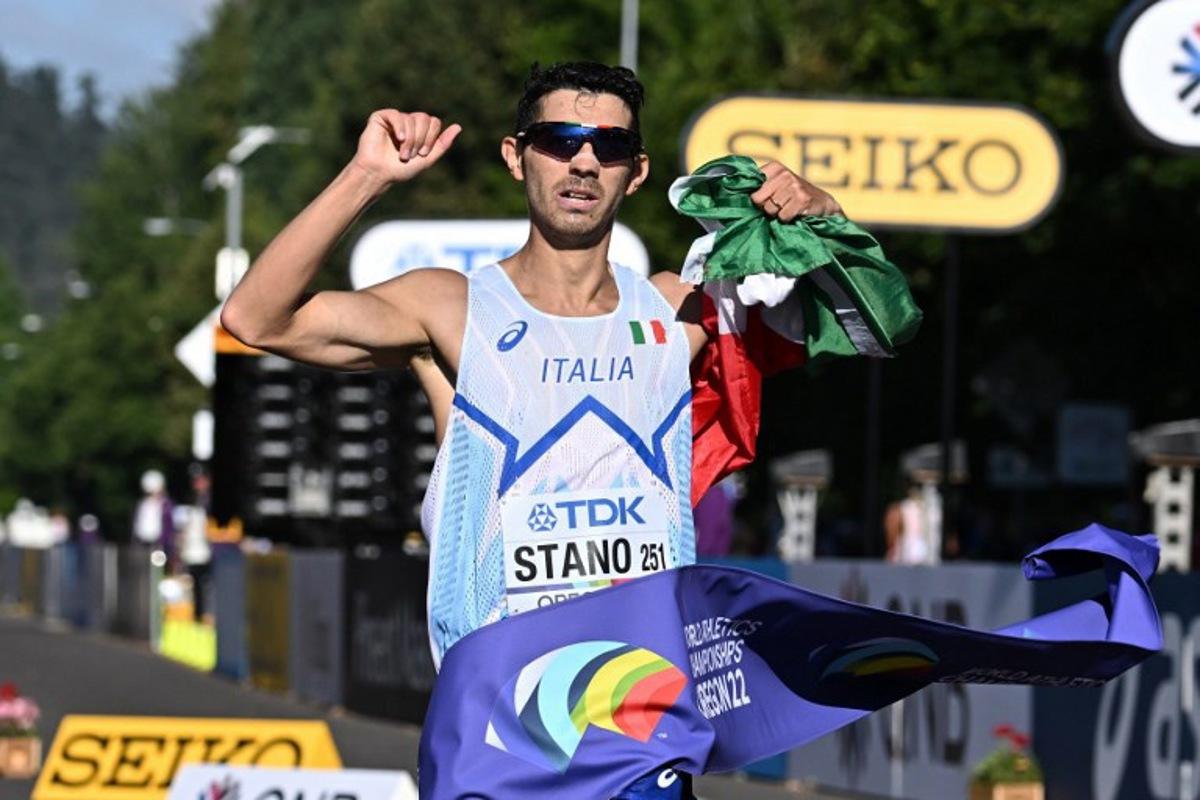Italy's Massimo Stano crosses the finish line to win the men's 35km race walk final during the World Athletics Championships in Eugene, Oregon on July 24, 2022.  Jim WATSON / AFP