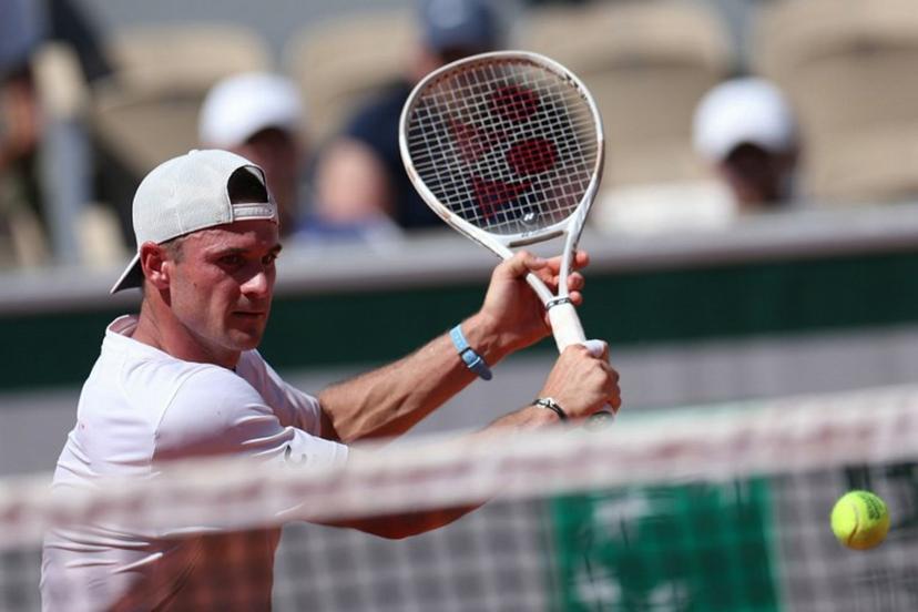 US Tommy Paul plays a backhand return to Russia's Karen Khachanov during their men's singles match on day 6 of the French Open tennis tournament on Court Simonne-Mathieu at the Roland-Garros Complex in Paris on May 30, 2025.  ALAIN JOCARD / AFP