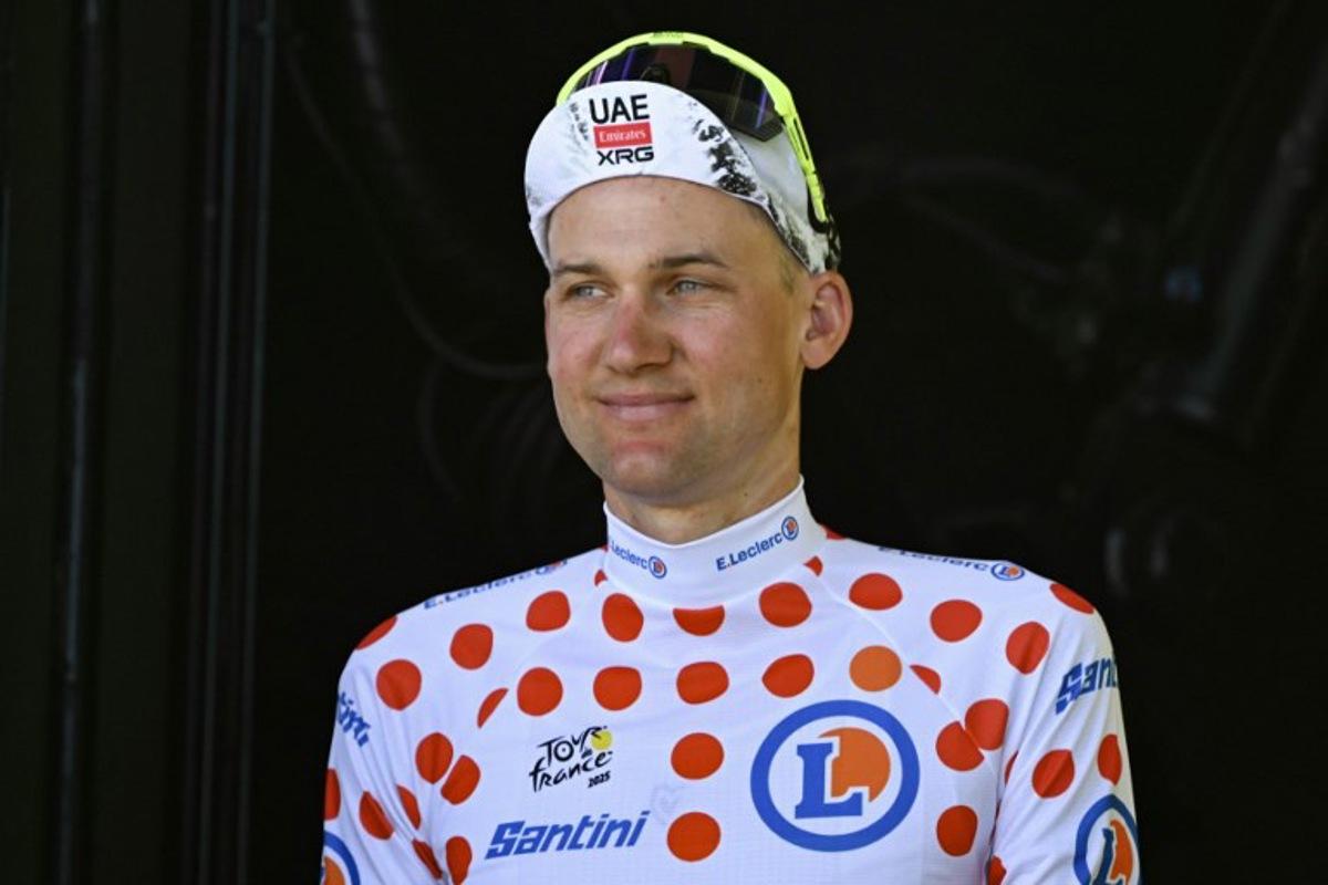 UAE Team Emirate - XRG team's Belgian rider Tim Wellens celebrates on the podium with the best climber's polka dot (dotted) jersey after the 7th stage of the 112th edition of the Tour de France cycling race, 197 km between Saint-Malo and Mur-de-Bretagne Guerledan, in Brittany, western France, on July 11, 2025.  Loic VENANCE / AFP