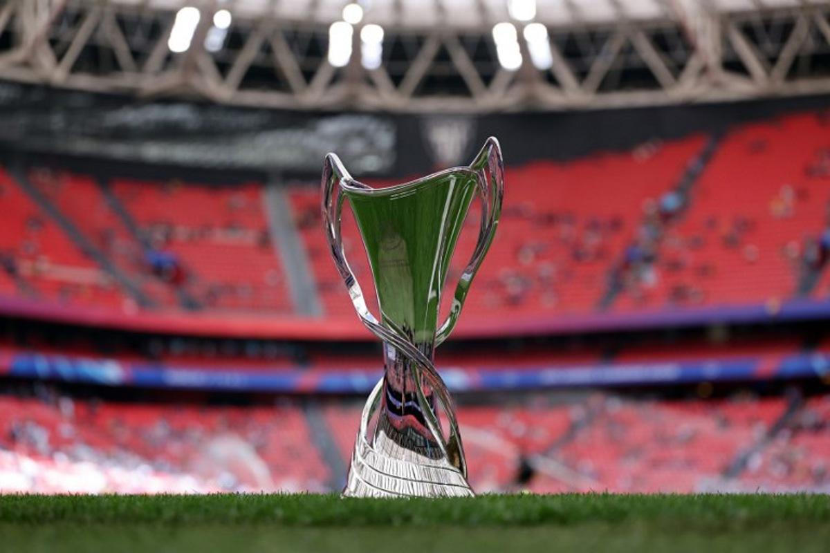 The championship's trophy is displayed on the pitch prior to the UEFA Women's Champions League final football match between FC Barcelona and  Olympique Lyonnais at the San Mames stadium in Bilbao on May 25, 2024.  Thomas COEX / AFP