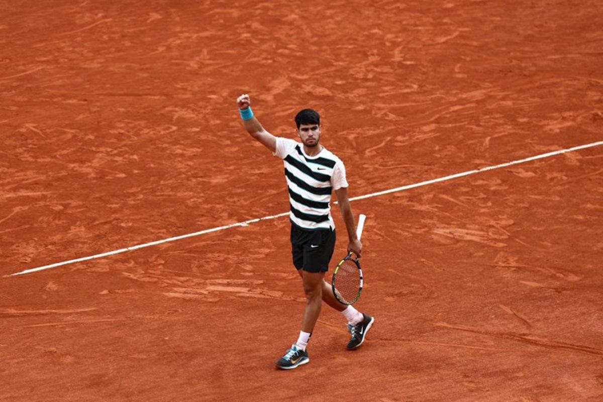 Spain's Carlos Alcaraz reacts after a point during his men's singles final match against Italy's Jannik Sinner on day 15 of the French Open tennis tournament on Court Philippe-Chatrier at the Roland-Garros Complex in Paris on June 8, 2025.  Thibaud MORITZ / AFP