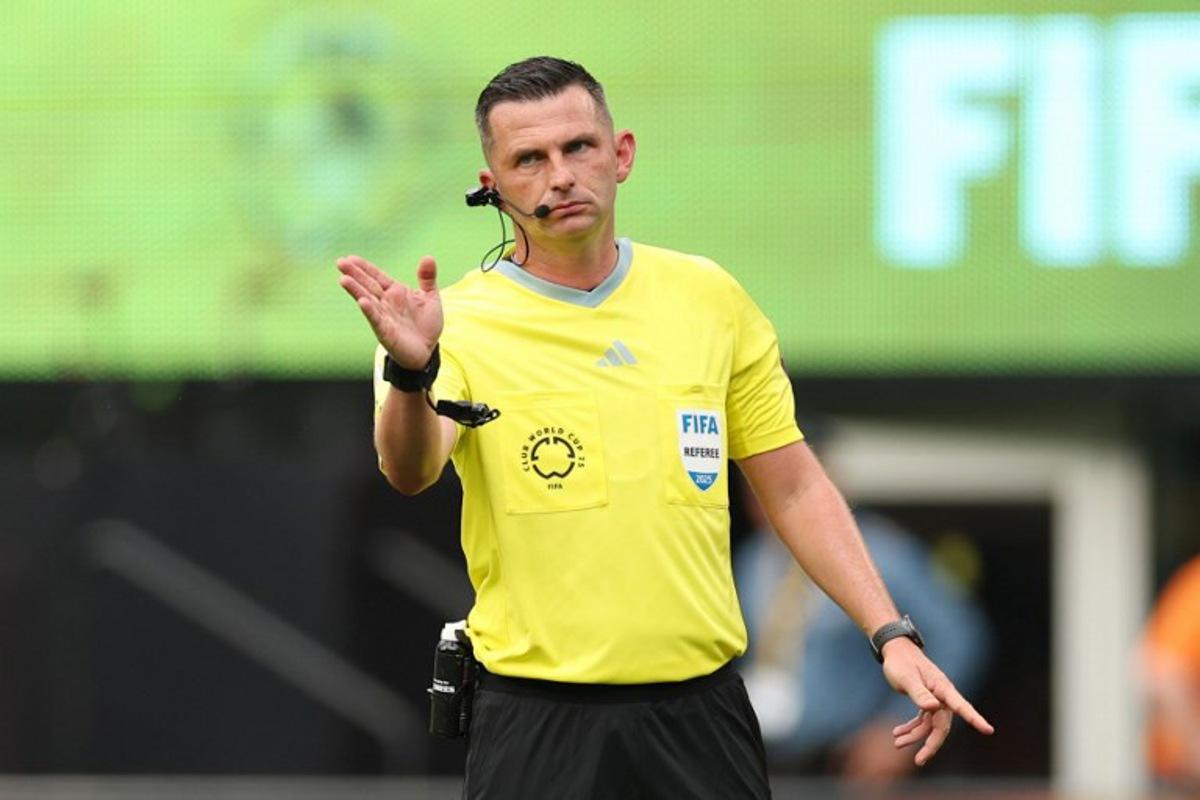 English referee Michael Oliver gestures during the FIFA Club World Cup 2025 Group F football match between Brazil's Fluminense and South Korea's Ulsan HD at the MetLife stadium in East Rutherford, New Jersey on June 21, 2025.  CHARLY TRIBALLEAU / AFP