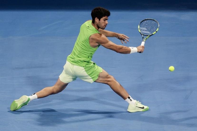 Spain's Carlos Alcaraz hits a return against France's Arthur Fils during their men's singles final match at the Qatar Open tennis tournament in Doha on February 21, 2026.  Karim JAAFAR / AFP