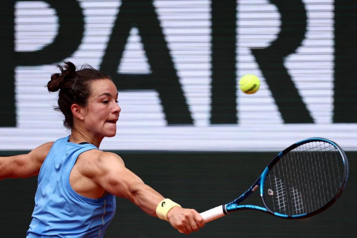 France's Lois Boisson plays a backhand return to US Jessica Pegula during their women's singles match on day 9 of the French Open tennis tournament on Court Philippe-Chatrier at the Roland-Garros Complex in Paris on June 2, 2025.  Anne-Christine POUJOULAT / AFP