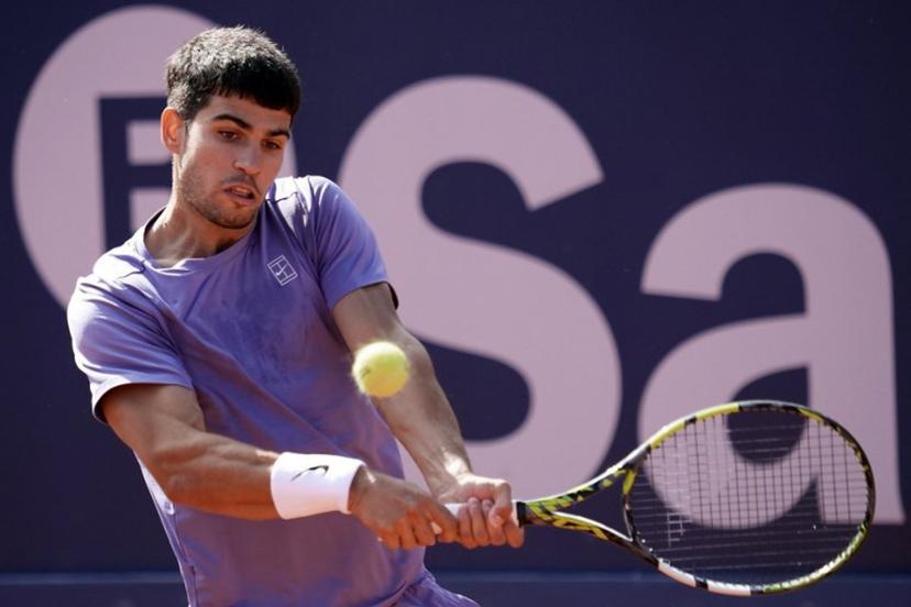 Spain's Carlos Alcaraz returns the ball to France's Arthur Fils during the ATP Barcelona Open "Conde de Godo" tennis tournament singles semi-final match at the Real Club de Tenis in Barcelona, on April 19, 2025.  MANAURE QUINTERO / AFP