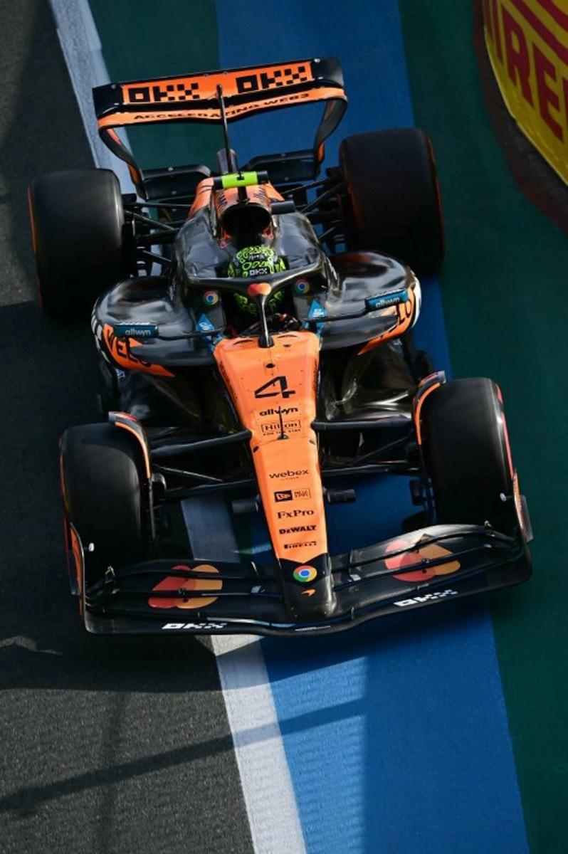 A picture taken through a window shows McLaren's British driver Lando Norris during the third practice session of the 2025 Saudi Arabia Formula One Grand Prix at the Jeddah Corniche Circuit on April 19, 2025.  Giuseppe CACACE / AFP