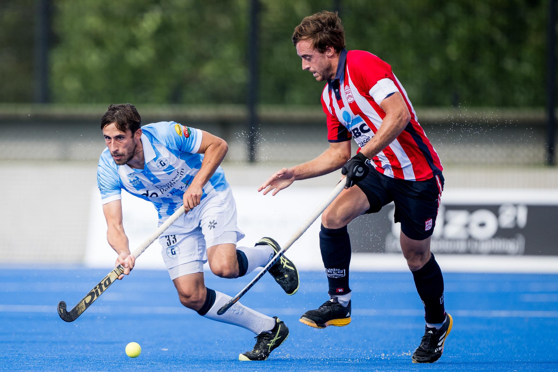 Gantoise's Charles Masson and Leopold's John Verdussen fight for the ball during a hockey game between Gantoise and Royal Leopold Club, Sunday 08 September 2024 in Gent, on the opening day the Belgian first division hockey championship. BELGA PHOTO JASPER JACOBS