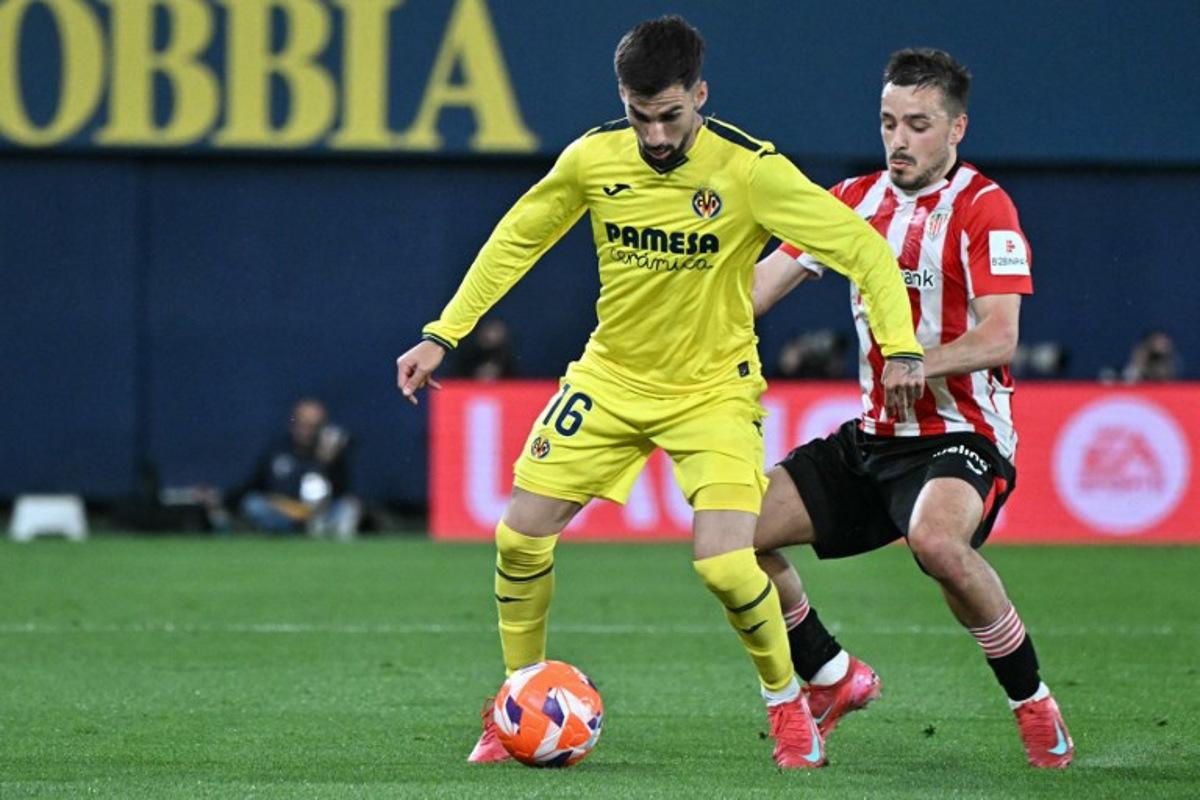 Villarreal's Spanish midfielder #16 Alex Baena and Athletic Bilbao's Spanish defender #02 Andoni Gorosabel vie for the ball during the Spanish league football match between Villarreal CF and Athletic Club Bilbao at La Ceramica stadium in Vila-real on April 6, 2025.  JOSE JORDAN / AFP
