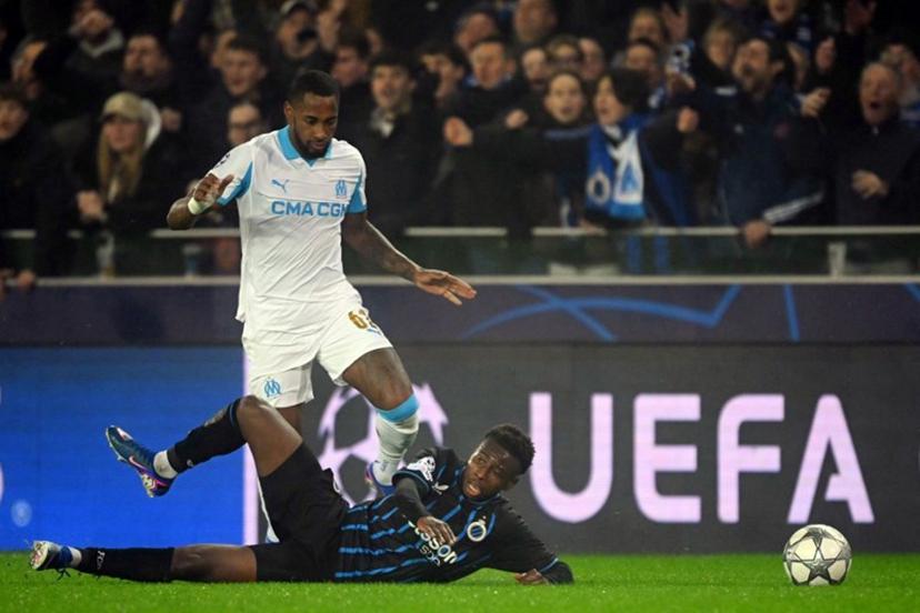 Marseille's Panamanian defender #62 Amir Murillo and Club Brugge's French forward #67 Mamadou Diakhon fight for the ball during the UEFA Champions League, league phase day 8, football match between Club Brugge KV and Olympique de Marseille, at the Jan Breydel Stadium in Bruges on January 28, 2026.  NICOLAS TUCAT / AFP