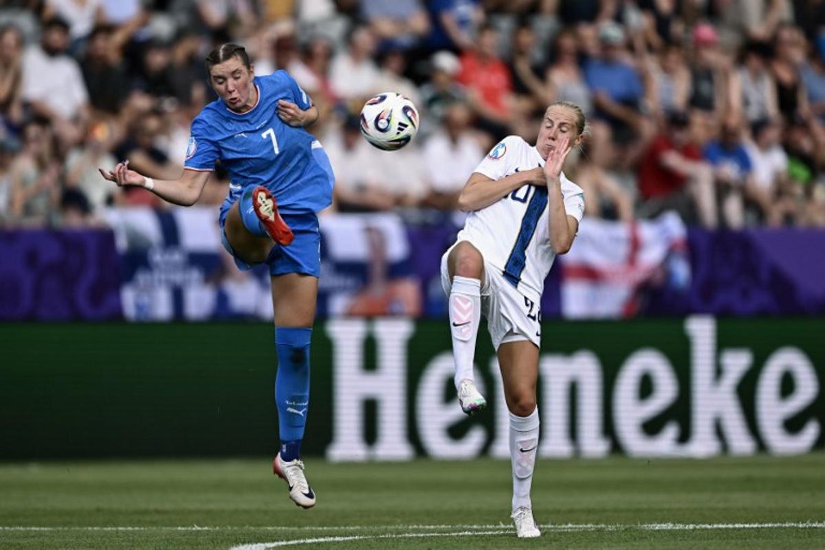 Iceland's midfielder #07 Karolina Lea Vilhjalmsdottir fights for the ball with Finland's midfielder #20 Eveliina Summanen during the UEFA Women's Euro 2025 Group A football match between Iceland and Finland at the Arena Thun stadium in Thun on July 2, 2025.   Fabrice COFFRINI / AFP