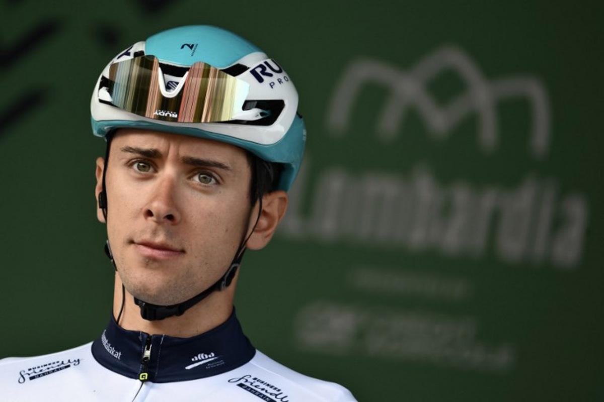 Bahrain Victorious's Italian riderAntonio Tiberi looks on from the sign-in podium ahead of the 119th edition of the Giro di Lombardia (Tour of Lombardy), a 238km cycling race from Como to Bergamo on October 11, 2025.  Marco BERTORELLO / AFP