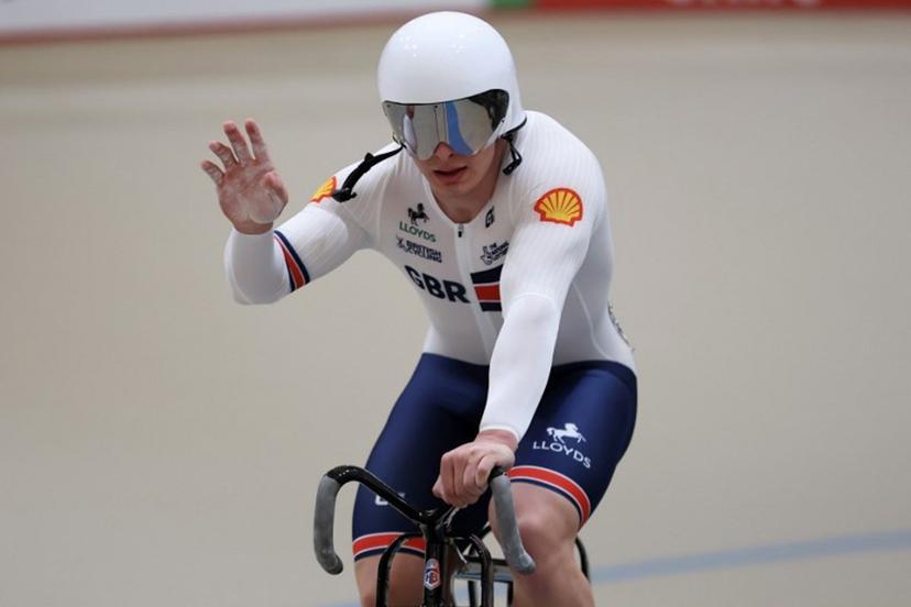 Great Britain's  #121 Matthew Richardson celebrates winning silver in the men's sprint final at the 2025 UCI Track World Championships, in the Penalolen Velodrome in Santiago, on October 26, 2025.  Javier TORRES / AFP