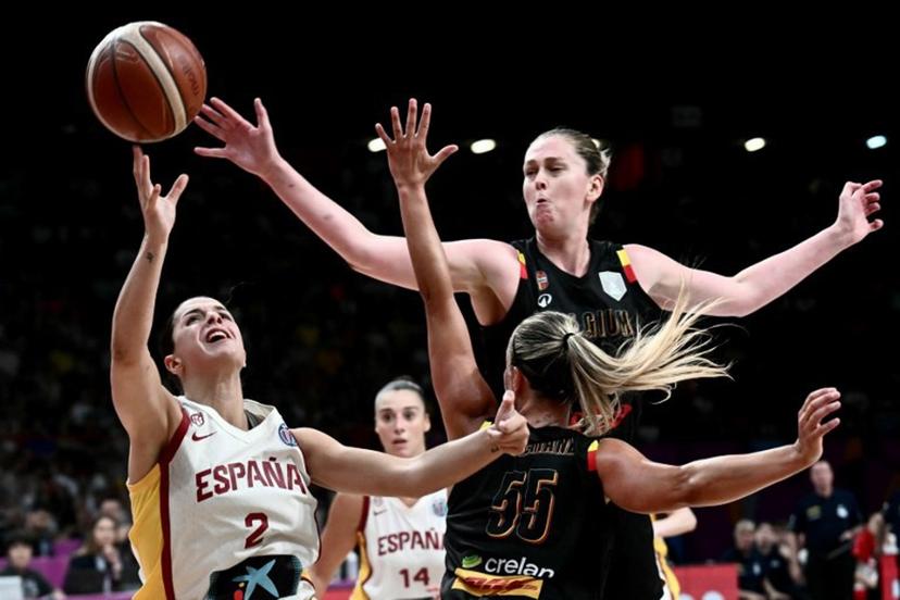 Spain's guard Elena Buenavida (L) attempts a lay-up during the FIBA Women's EuroBasket 2025 final match between Spain and Belgium at the Peace and Friendship Stadium in Athens on June 29, 2025.  Angelos Tzortzinis / AFP
