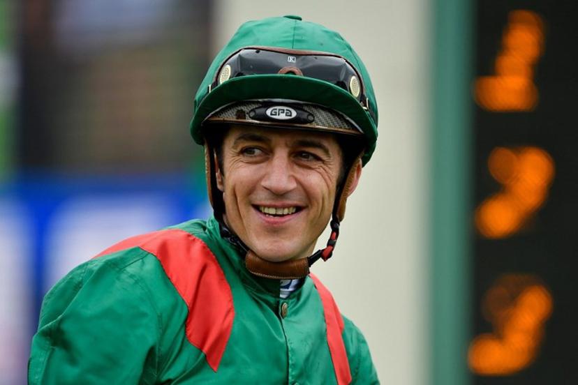 Belgian jockey Christophe Soumillon riding Vadeni reacts after winning the 182nd edition of The Prix du Jockey-Club horse race at the Hippodrome de Chantilly in Chantilly, north of Paris on June 5, 2022.   JULIEN DE ROSA / AFP