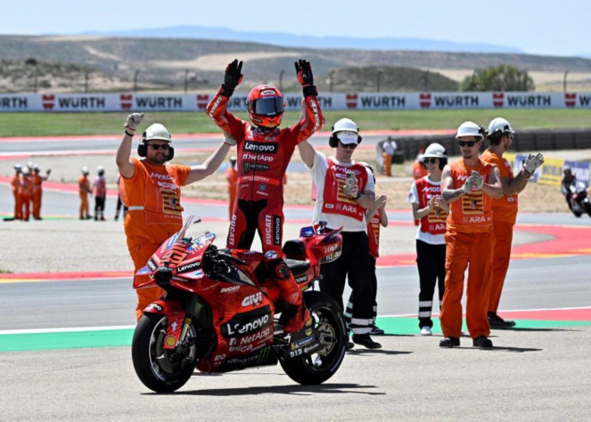 Team Ducati Lenovo Team's Marc Marquez celebrates winning the sprint race of the MotoGP Aragon Grand Prix at the Motorland circuit in Alcaniz, northeastern Spain, on June 7, 2025.   JOSE JORDAN / AFP