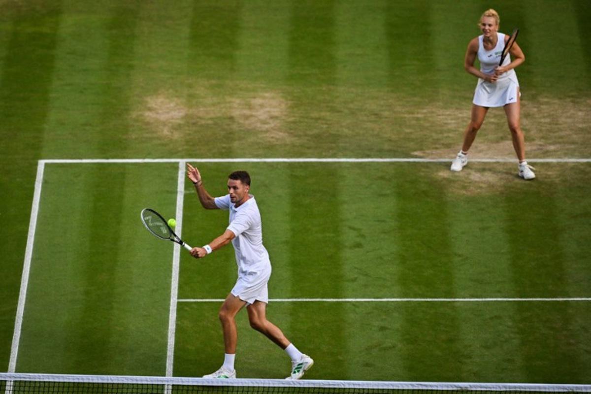 Netherlands' Sem Verbeek (L) and Czech Republic's Katerina Siniakova return the ball to Britain's Joe Salisbury and Brazil's Luisa Stefani during their mixed's doubles final tennis match on the eleventh day of the 2025 Wimbledon Championships at The All England Lawn Tennis and Croquet Club in Wimbledon, southwest London, on July 10, 2025.  Glyn KIRK / AFP