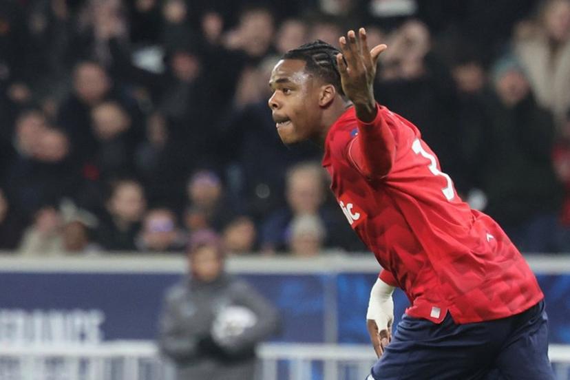 Lille's Belgian defender #03 Nathan Ngoy celebrates scoring his team's first goal during the French Cup round of 32 football match between Lille OSC and Olympique Lyonnais at the Stade Pierre-Mauroy in Villeneuve-d'Ascq, northern France on January 11, 2026.  Francois LO PRESTI / AFP