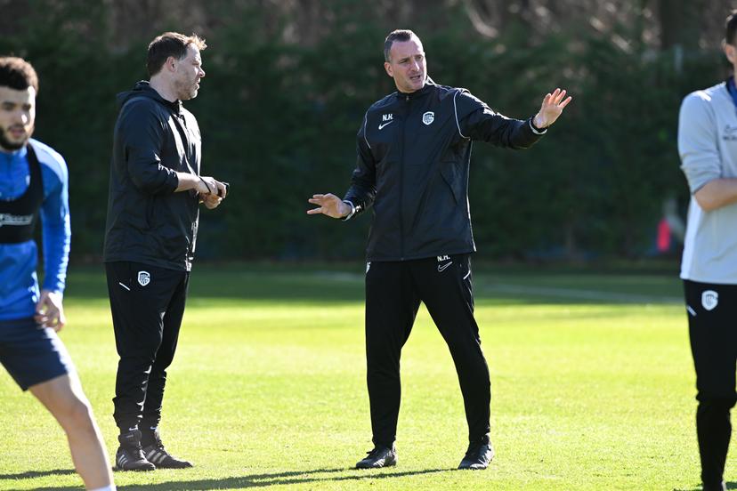 Genk's assistant coach Johan Van Rumst and Genk's head coach Nicky Hayen pictured during a training session of Belgian soccer team KRC Genk, Wednesday 25 February 2026 in Genk. The team is preparing for tomorrow's match against Croatian GNK Dinamo Zagreb, in the play-off for the knockout phase of the UEFA Europa League tournament. Genk won the first leg 1-3. BELGA PHOTO JILL DELSAUX