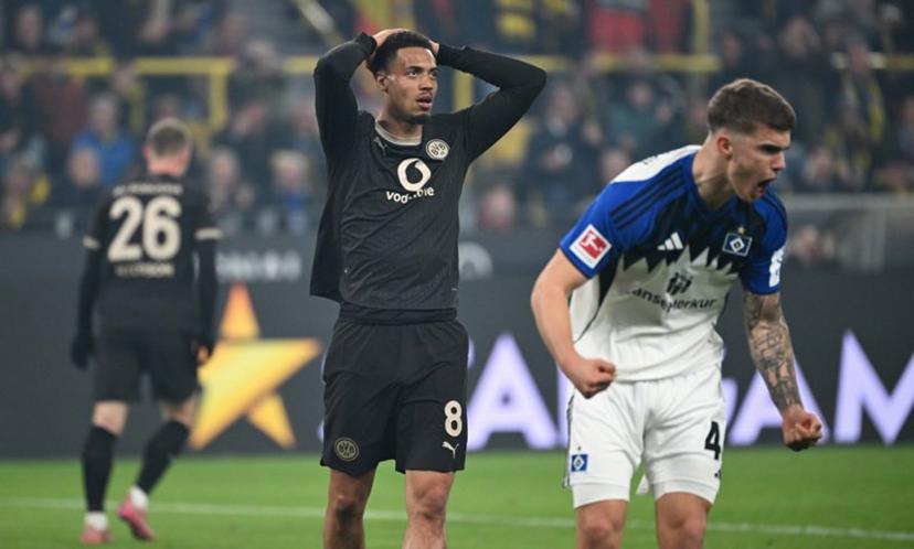 Dortmund's German midfielder #08 Felix Nmecha reacts during the German first division Bundesliga football match between Borussia Dortmund and HSV Hamburg in Dortmund, western Germany, on March 21, 2026.  UWE KRAFT / AFP