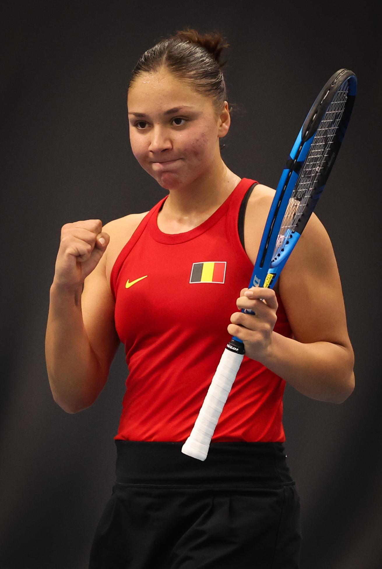 Belgian Sofia Costoulas celebrates after winning a tennis match between Belgian Costoulas and Hungarian Toth, in the meeting between Belgium and Hungary in the pool phase of the Europe/Africa Group I of the Billie Jean King Cup tennis, in Vilnius, Lithuania on Wednesday 09 April 2025. PHOTO VIRGINIE LEFOUR PHOTO VIRGINIE LEFOUR