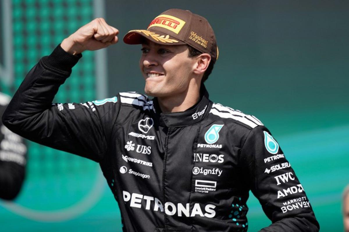 Mercedes' British driver George Russell celebrates on the podium after winning 2025 Formula 1 Grand Prix du Canada at Circuit Gilles-Villeneuve in Montreal, Canada, on June 15, 2025.   Geoff Robins / AFP