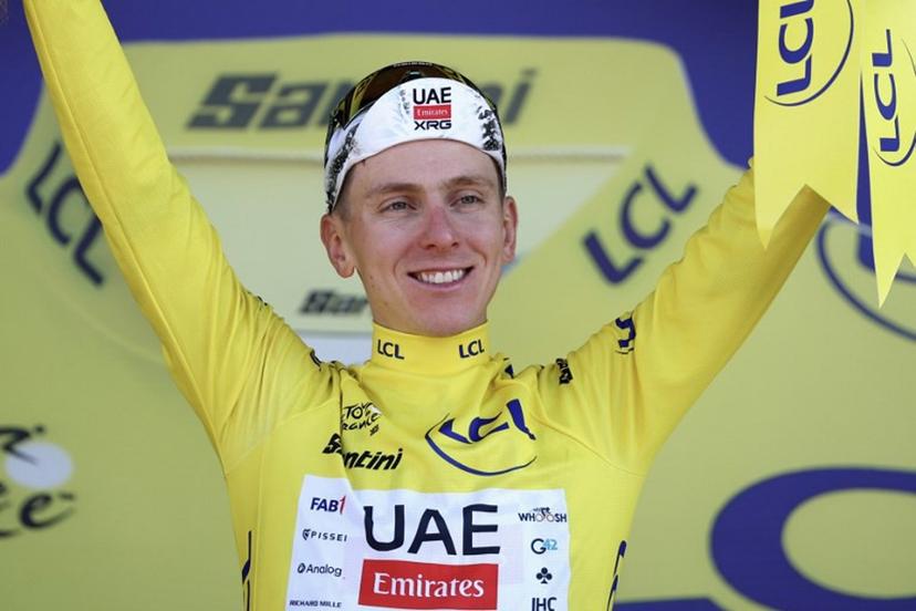 UAE Team Emirates - XRG team's Slovenian rider Tadej Pogacar celebrates on the podium with the overall leader's yellow jersey after the 13th stage of the 112th edition of the Tour de France cycling race, 10.9 km individual time trial between Loudenvielle and Peyragudes, in the Pyrenees mountains of southwestern France, on July 18, 2025.  Anne-Christine POUJOULAT / AFP