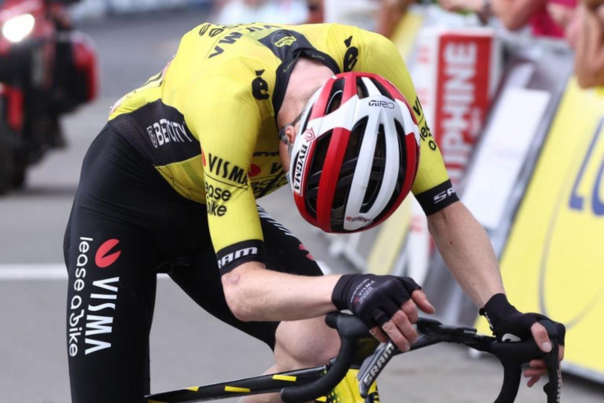 Team Visma - Lease a Bike's Danish rider Jonas Vingegaard reacts as he crosses the finish line the 7th stage of the 77th edition of the Criterium du Dauphine cycling race, 131,6 km between Grand-Aigueblanche and Valmeinier, on June 14, 2025.  Anne-Christine POUJOULAT / AFP
