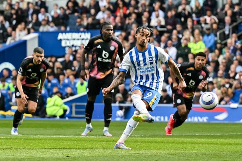 Brighton's Brazilian striker #09 Joao Pedro shoots a penalty kick and scores his team second goal during the English Premier League football match between Brighton and Hove Albion and Leicester City at the American Express Community Stadium in Brighton, southern England on April 12, 2025.  Glyn KIRK / AFP