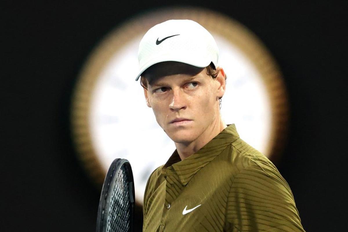 Italy's Jannik Sinner reacts on a point to USA's Ben Shelton during their men's singles quarter-final match on day eleven of the Australian Open tennis tournament in Melbourne on January 28, 2026.  DAVID GRAY / AFP