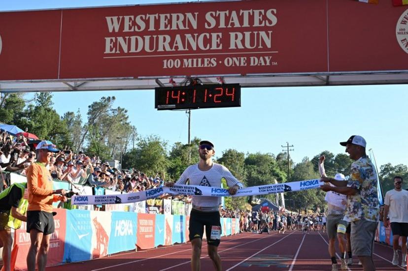 USA's Caleb Olson crosses the finish line to win the 2025 Western States Endurance Run with a time of 14 hours 11 minutes and 25 seconds, at Placer High School in Auburn, California on June 28, 2025.   The Western States Endurance Run, the world's oldest 100-mile trail race, takes 369 runners from the Olympic Valley valley floor (elevation 6,200 feet) to Emigrant Pass (elevation 8,750 feet), a climb of 2,550 vertical feet in the first 4½ miles. From the pass, following the original trails used by the gold and silver miners of the 1850's, runners travel west, climbing another 15,540 feet and descending 22,970 feet before reaching Auburn, a small town in the heart of California's historic gold country. Most of the trail passes through remote and rugged territory. Robyn Beck / AFP