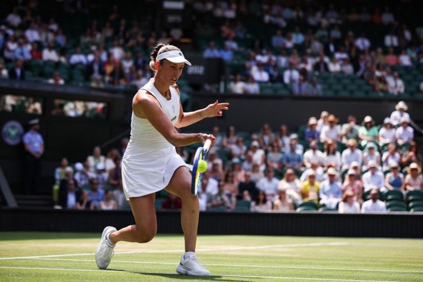 Belgium's Elise Mertens playing with Russia's Veronika Kudermetova returns the ball to Taiwan's Hsieh Su-wei and Latvia's Jelena Ostapenko during their women's doubles final tennis match on the fourteenth day of the 2025 Wimbledon Championships at The All England Lawn Tennis and Croquet Club in Wimbledon, southwest London, on July 13, 2025.  HENRY NICHOLLS / AFP