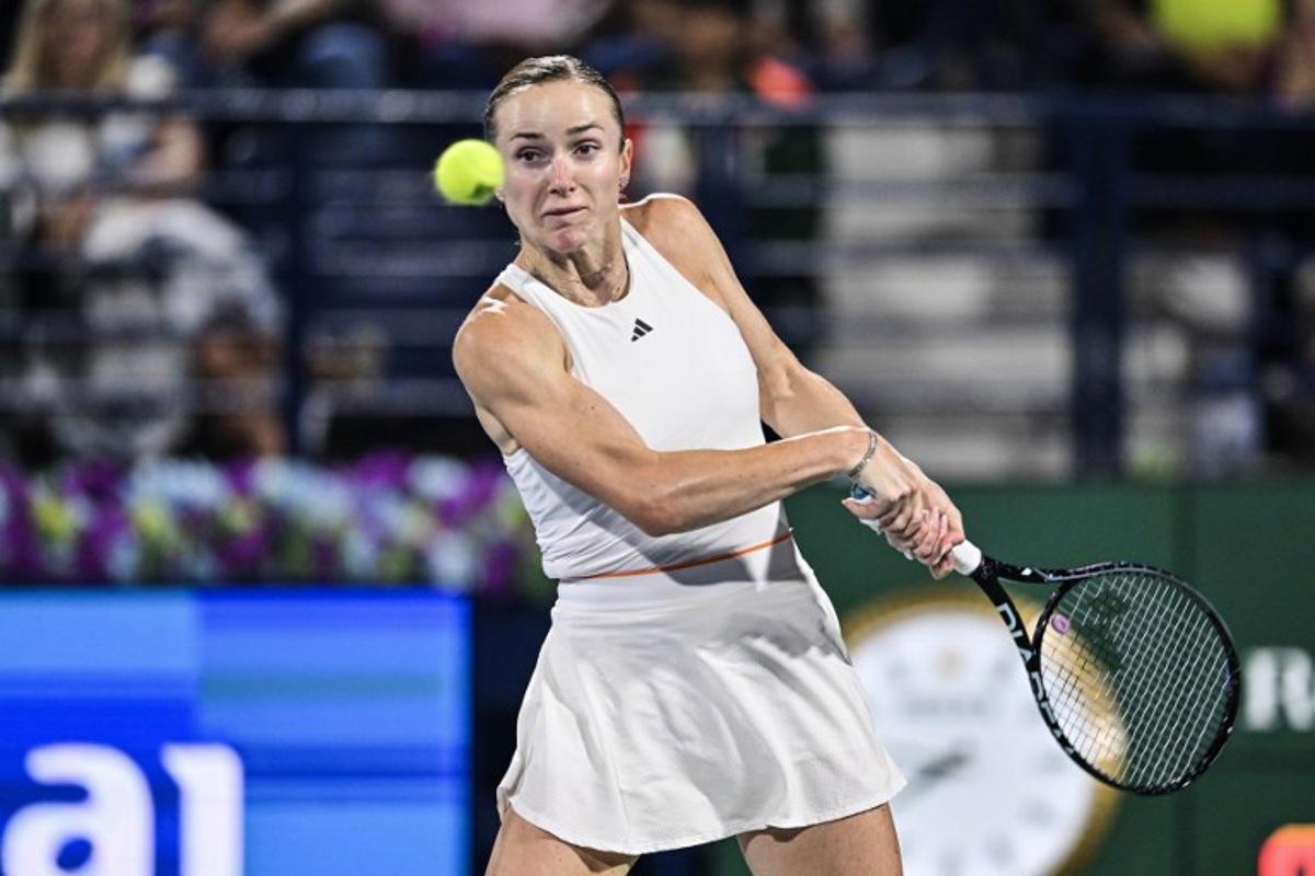 Ukraine's Elina Svitolina hits a return to US' Jessica Pegula during their women's singles final match at the Dubai Duty Free Tennis tournament in Dubai on February 21, 2026.  Ryan Lim / AFP