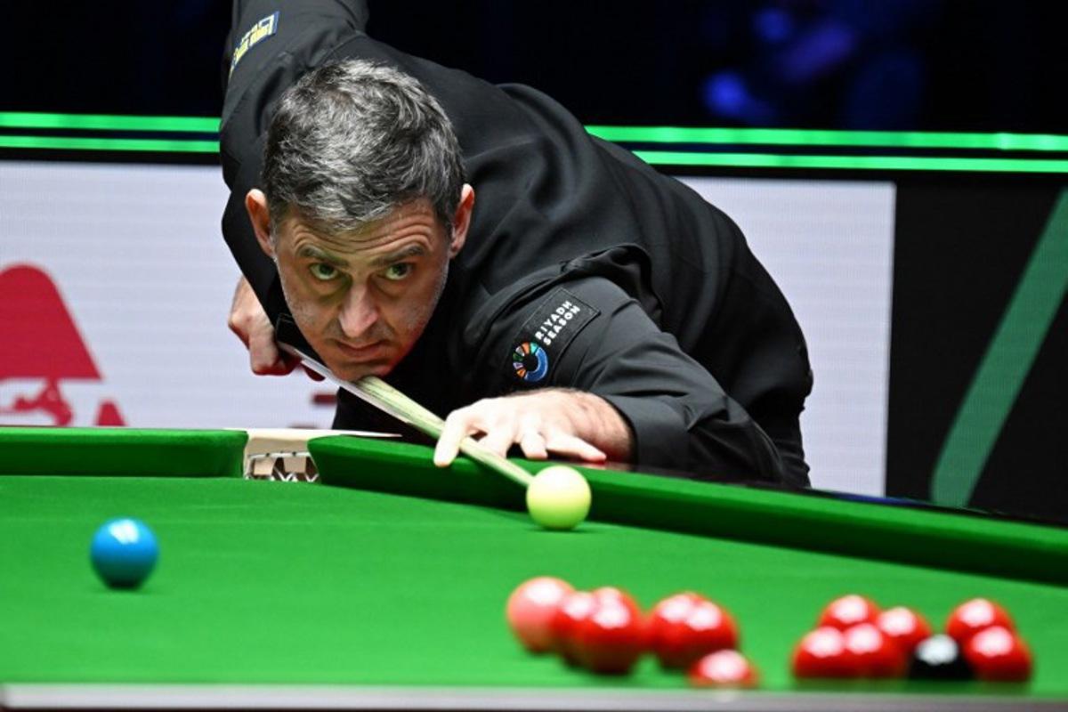 Britain's Ronnie O'Sullivan plays a shot against against compatriot Joe O'Connor in round 1 of the Snooker World Grand Prix 2026 in Hong Kong on February 4, 2026.  Peter PARKS / AFP