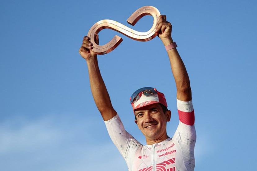 Third placed EasyPost's Ecuadorian rider Richard Carapaz celebrates on the podium after the 21st and last stage of the 108th Giro d'Italia cycling race of 143kms from Rome to Rome on June 1, 2025.  Luca Bettini / AFP