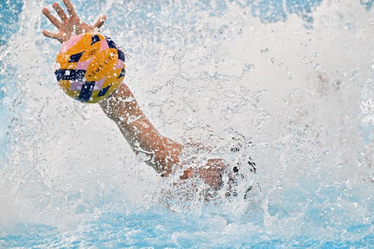 Hungary's #08 Gergo Zalanki vies for the ball in the men's water polo preliminary round group B match between Spain and Hungary during the Paris 2024 Olympic Games at the Aquatics Centre in Saint-Denis, north of Paris, on July 30, 2024.  Andreas SOLARO / AFP
