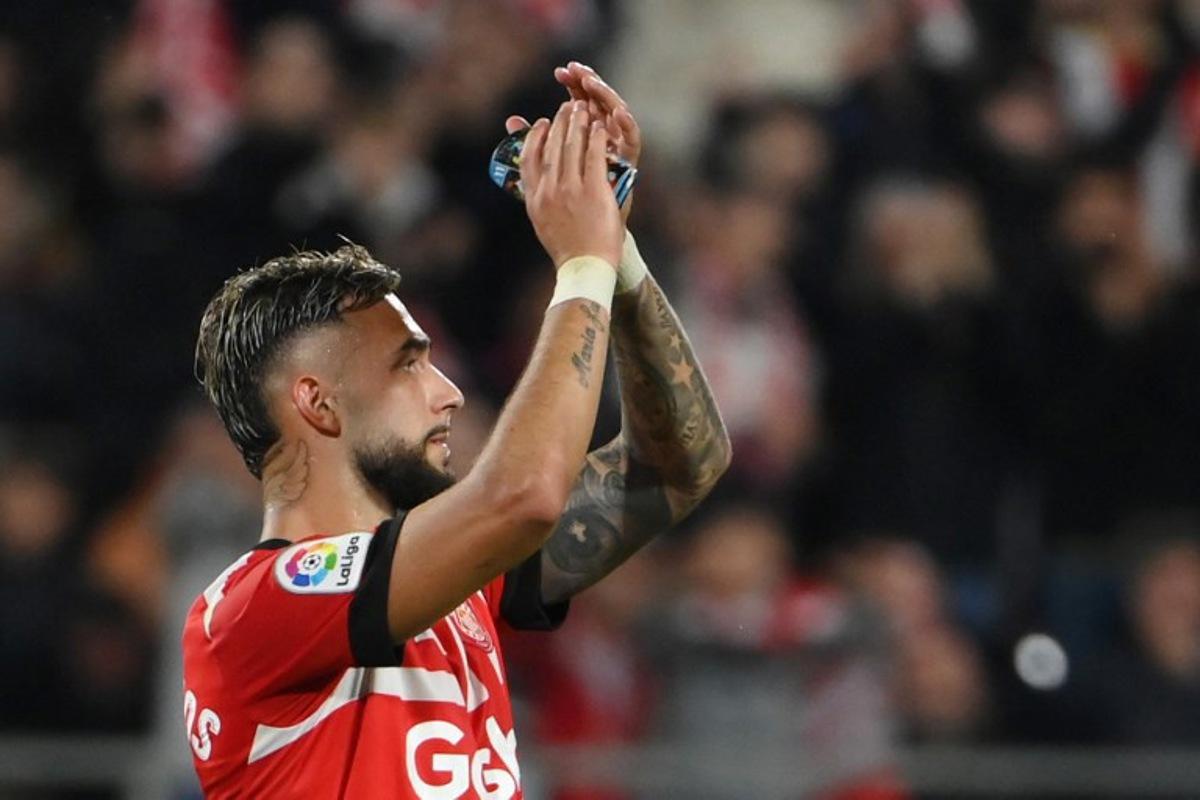 Girona's Argentinian forward Taty Castellanos acknowledges the crowd as he leaves the pitch after scoring four goals during the Spanish league football match between Girona FC and Real Madrid CF at the Montilivi stadium in Girona on April 25, 2023.  LLUIS GENE / AFP