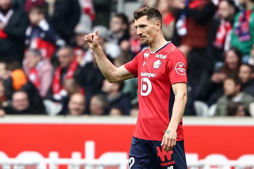 Lille's Belgian defender #12 Thomas Meunier celebrates after scoring his team's opening goal during the French L1 football match between Lille LOSC and AJ Auxerre at Stade Pierre-Mauroy in Villeneuve-d'Ascq, northern France on April 20, 2025.  Sameer Al-DOUMY / AFP