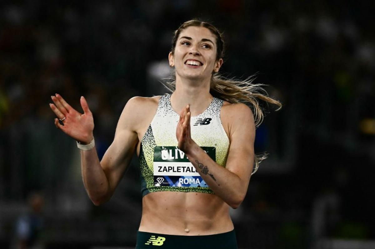 Slovakia's Emma Zapletalova celebrates after winning in the women's 400m Hurdles during the IAAF Diamond League athletics meeting, at the Olympic Stadium, in Rome on June 4, 2026. Filippo MONTEFORTE / AFP