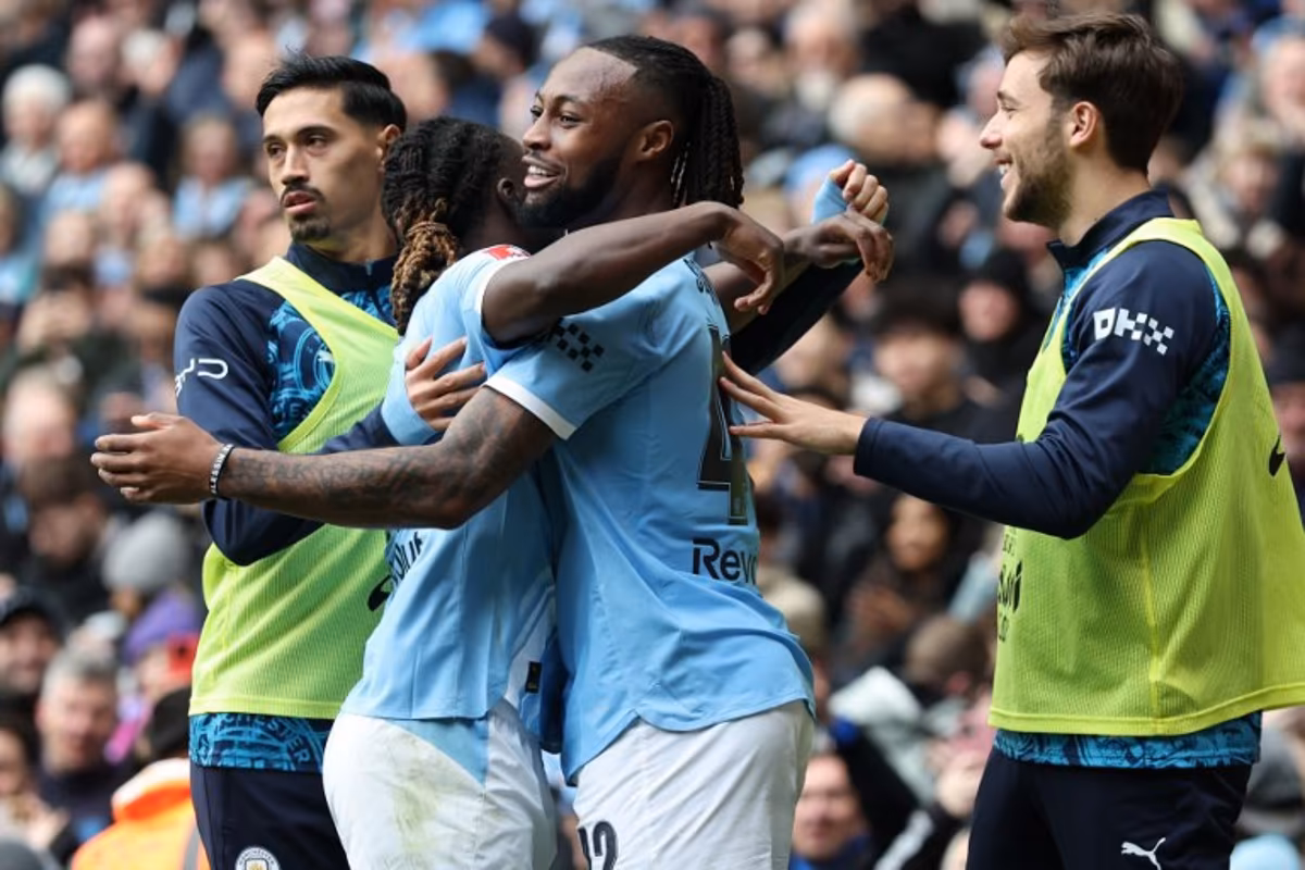 Manchester City's Ghanaian midfielder #42 Antoine Semenyo (C) celebrates with teammates after scoring their third goal during the English FA Cup quarter final football match between Manchester City and Liverpool at the Etihad Stadium in Manchester, north west England, on April 4, 2026. Darren Staples / AFP